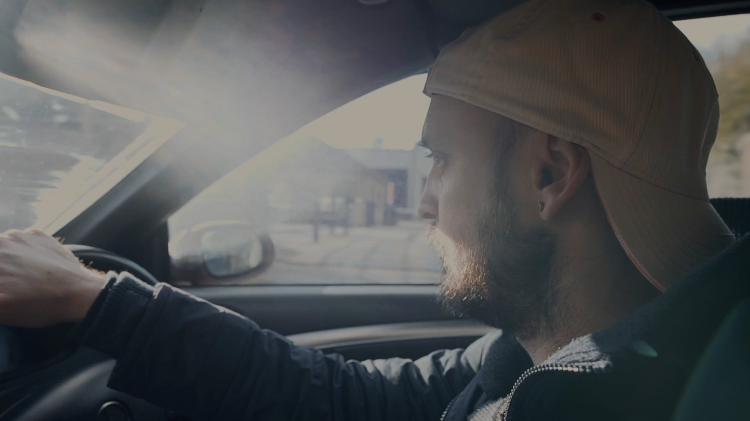 Ryan Wicks driving in his car.