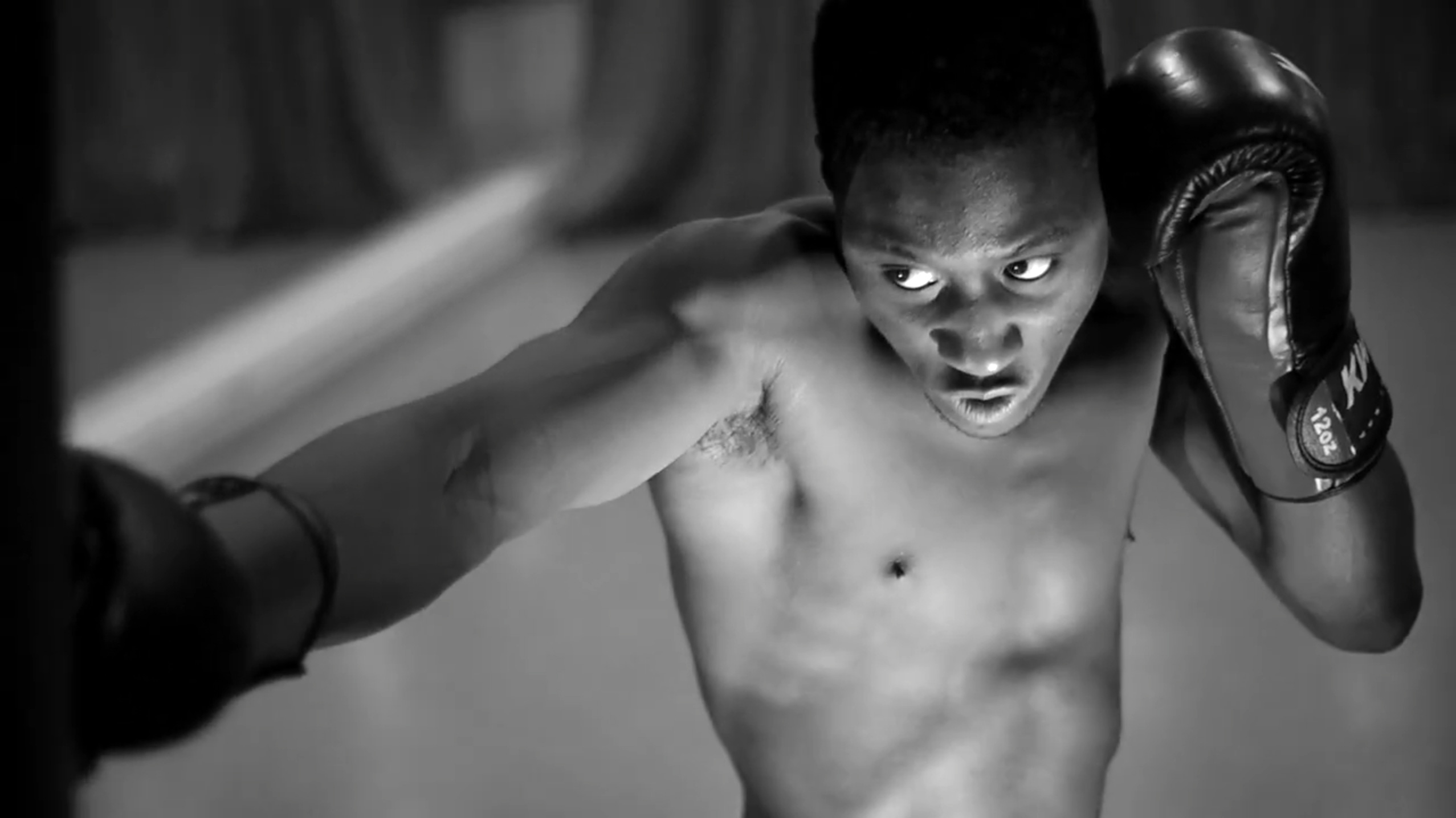 Tinnitus film thumbnail of a boxer training intensely in black and white